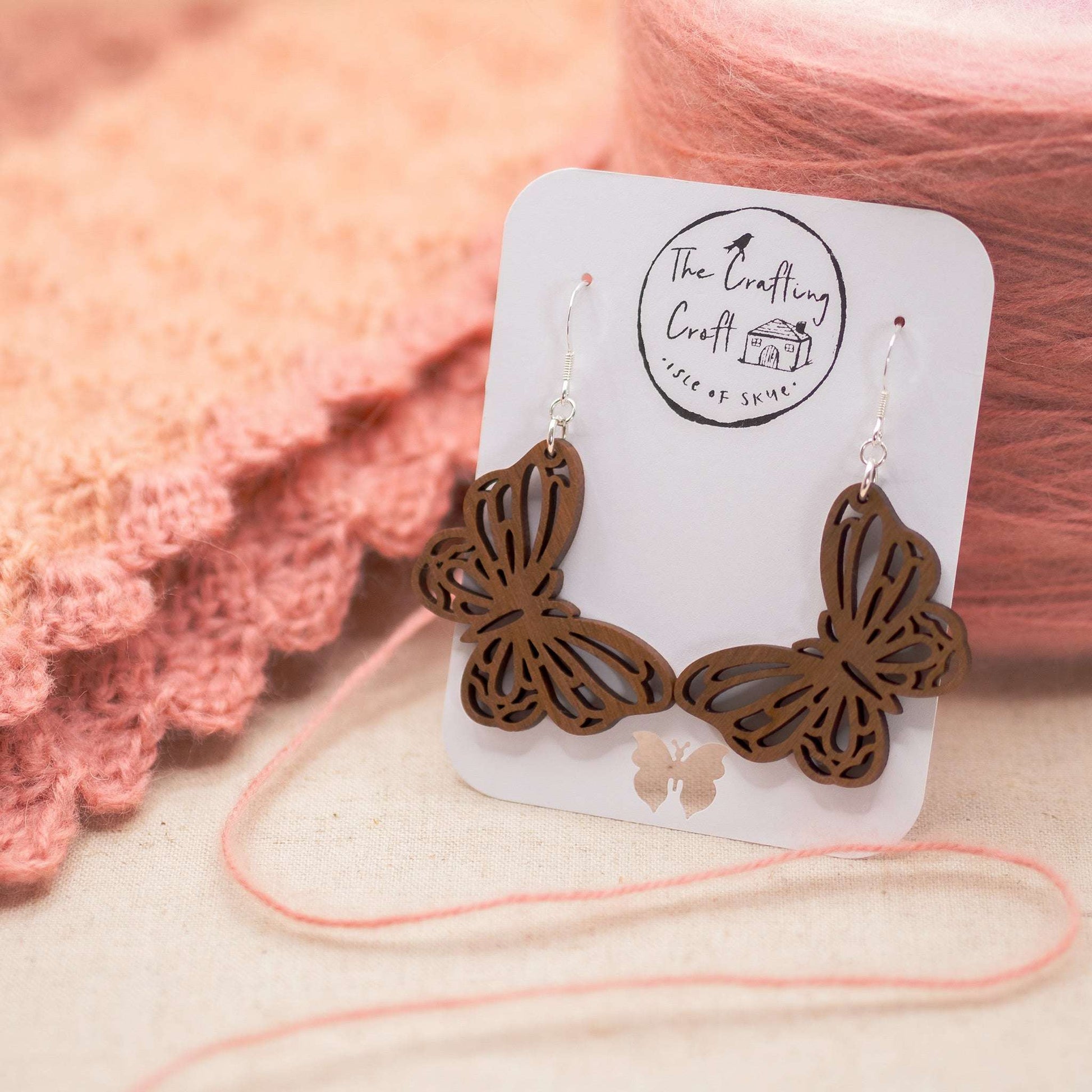 Butterfly drop earrings laser cut from sustainable solid walnut wood