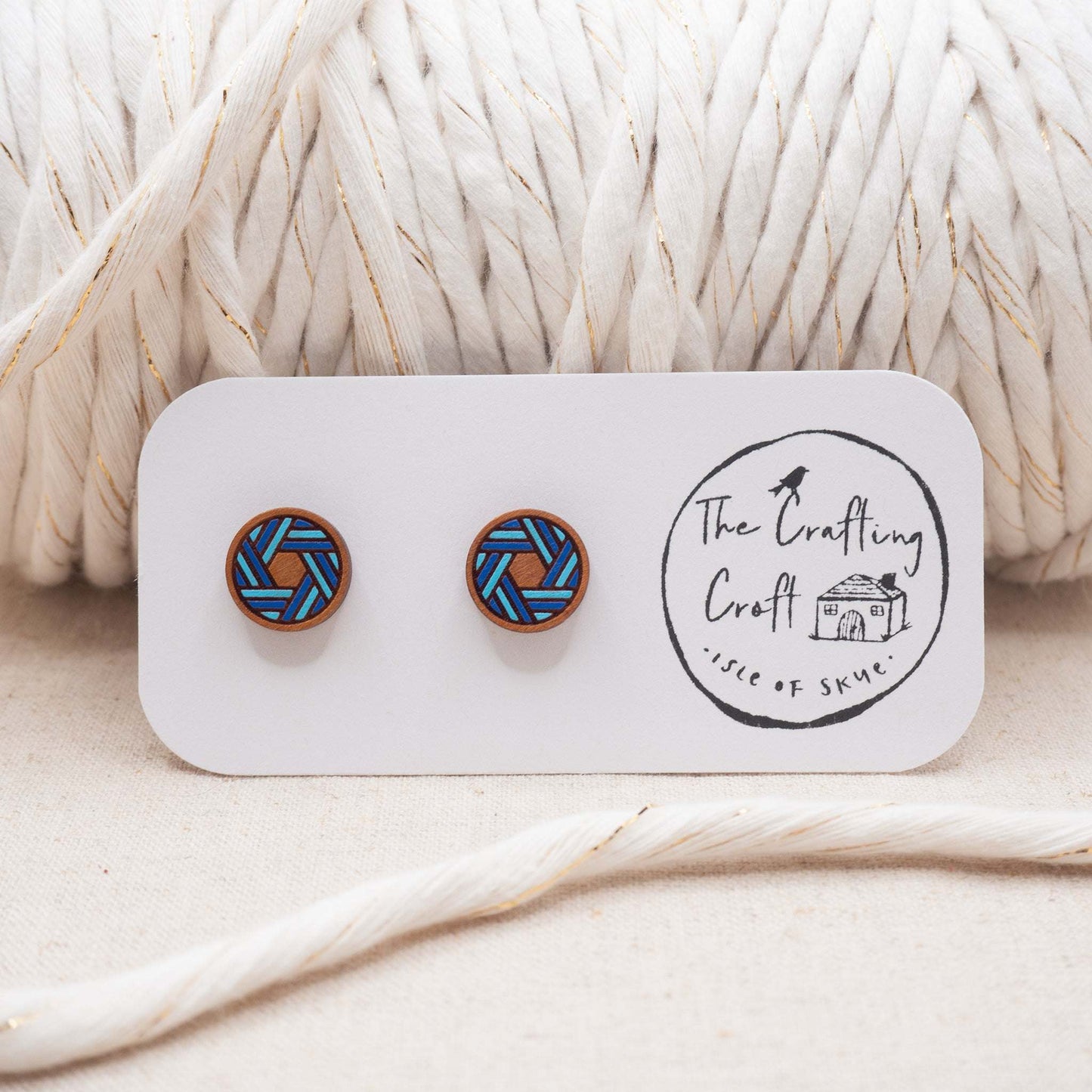 Knots of blue painted stud earrings enhance your style