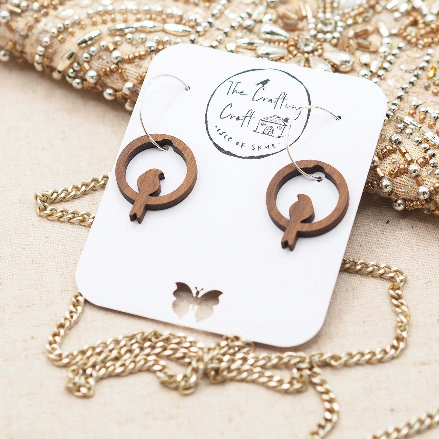 Silhouette perching bird hoop earrings 