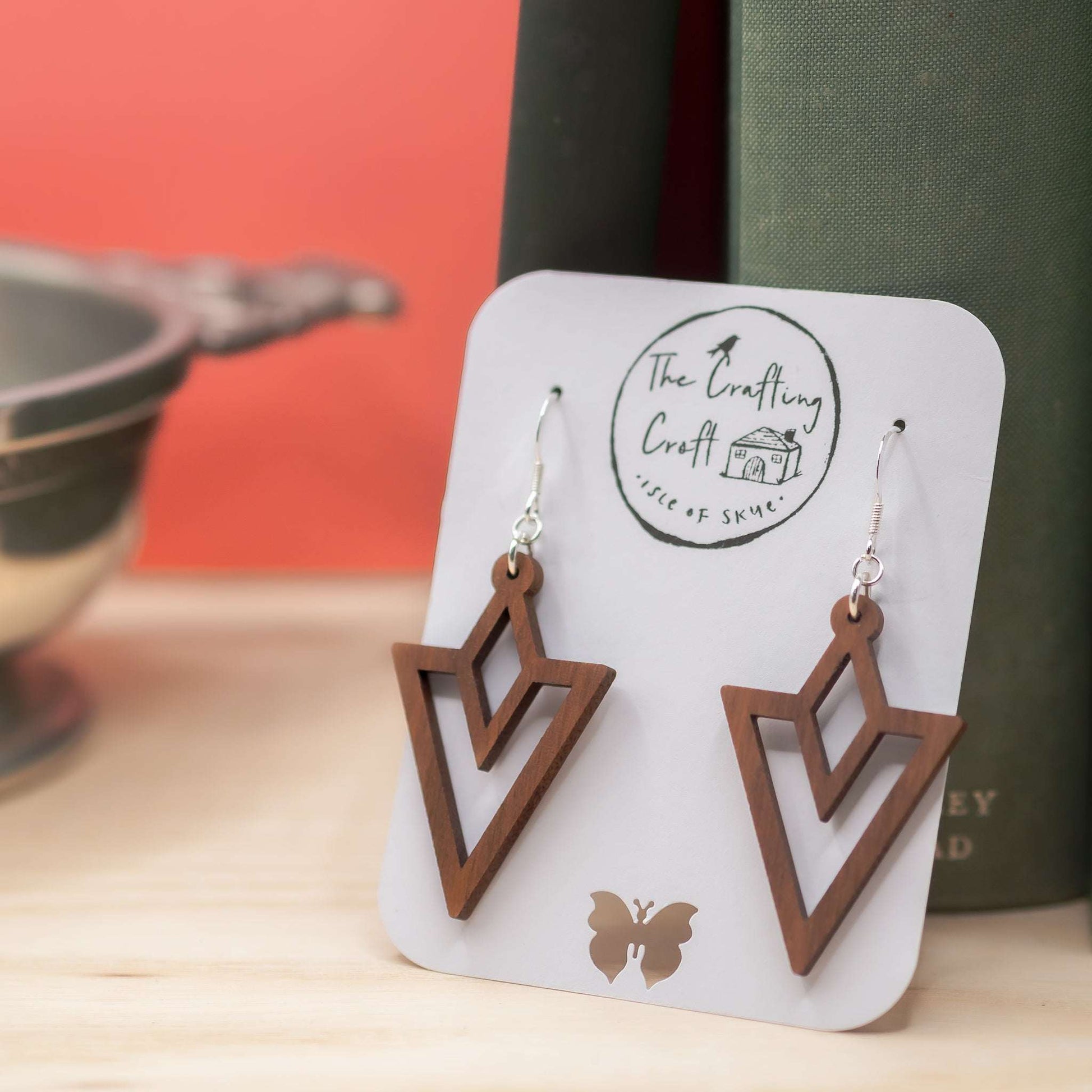 Triangle outline drop earrings laser cut from solid walnut and beeswax protected