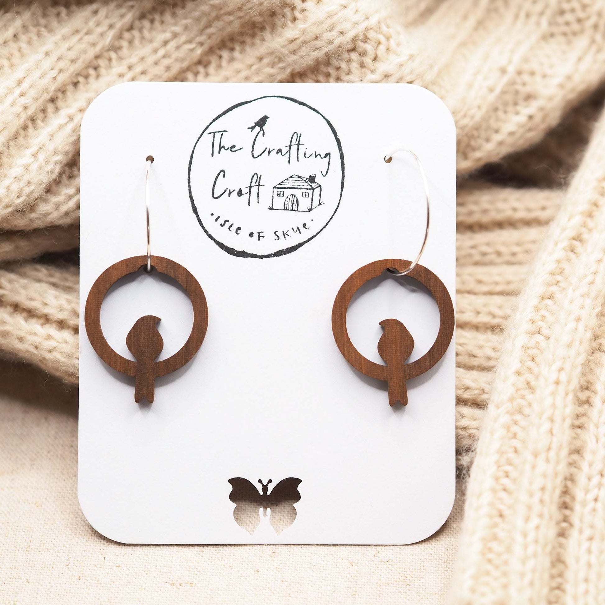 Laser cut light beeswax protective coating on our perching bird hoop earrings