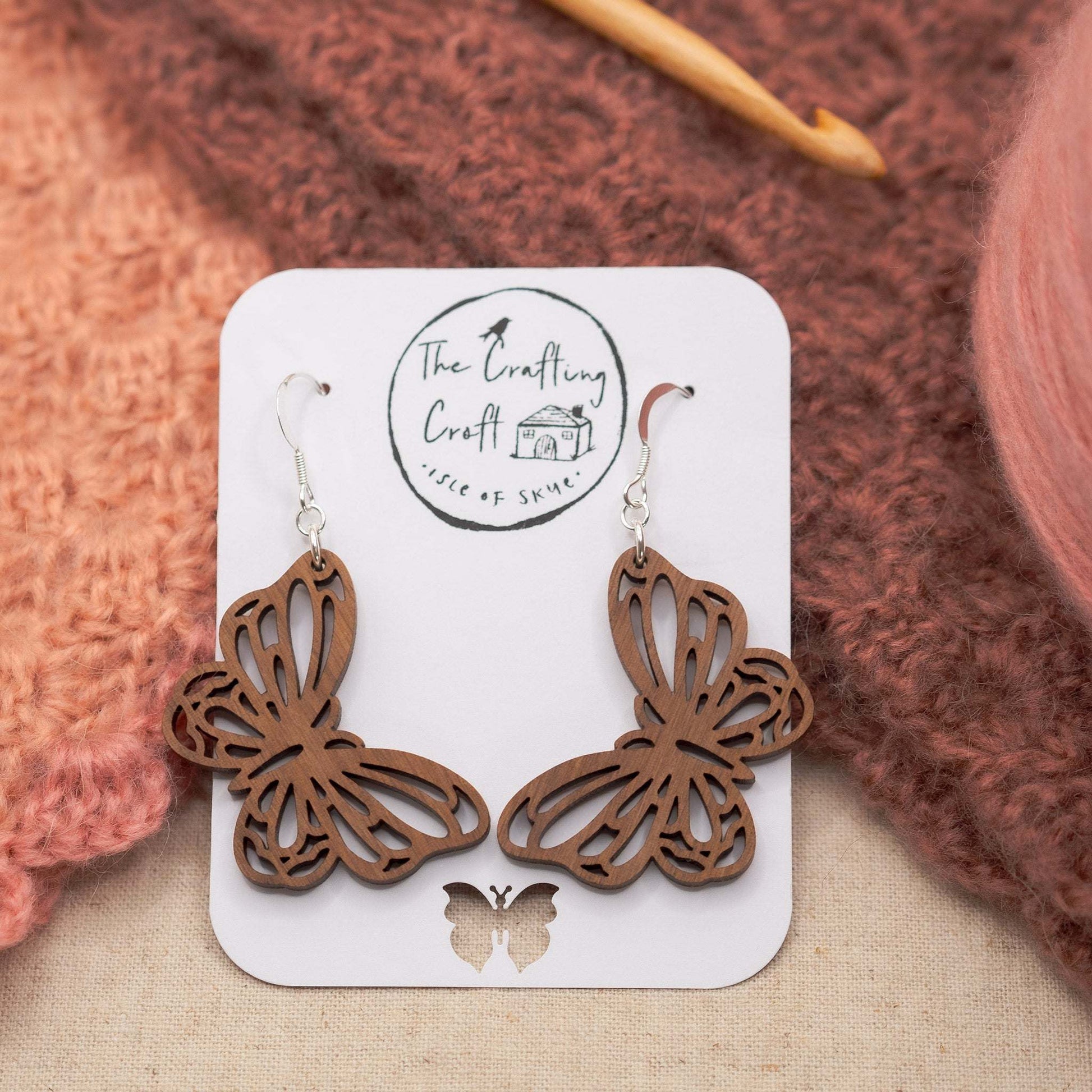 Butterfly drop earrings in solid walnut with a protective beeswax coating