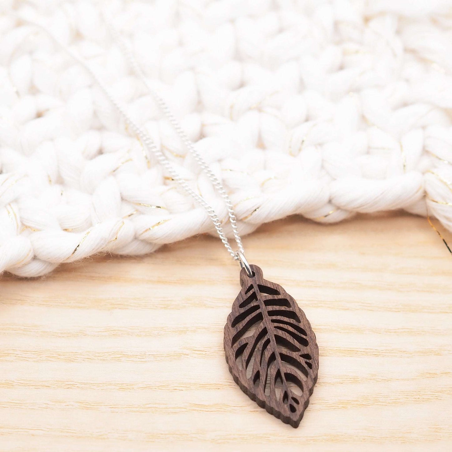 Laser precision cut in solid walnut wood our leaf skeleton necklace