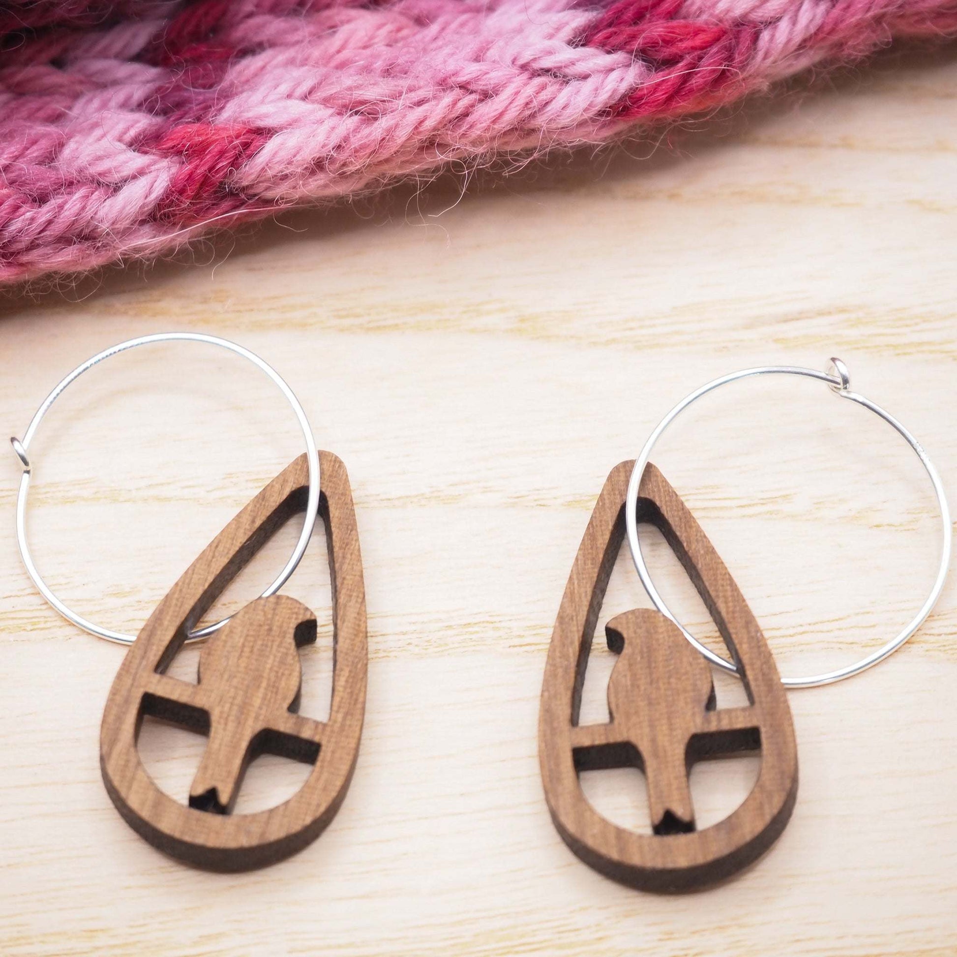 Solid walnut perching bird hoop earrings