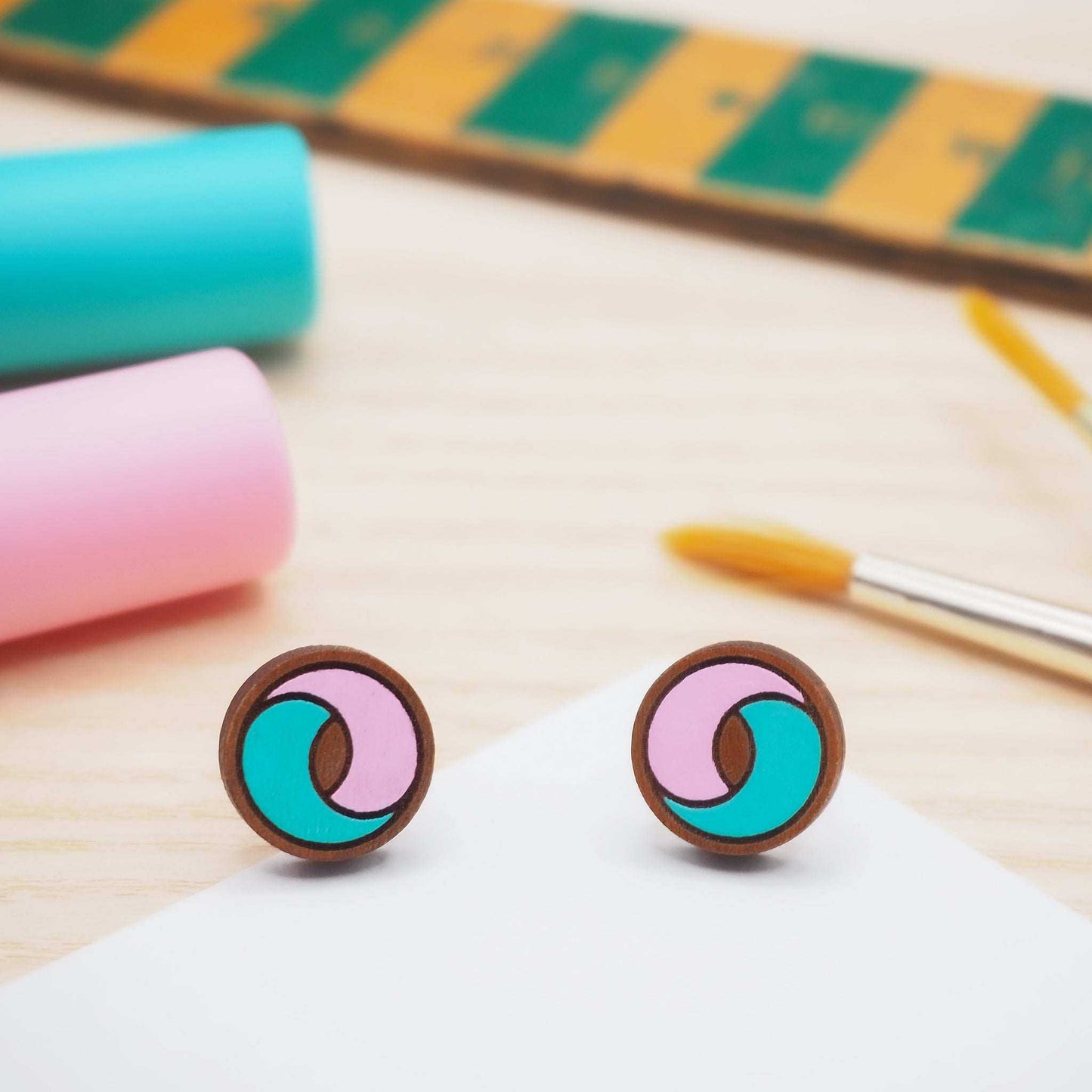 Swirling pink and aqua delicate stud earrings. 