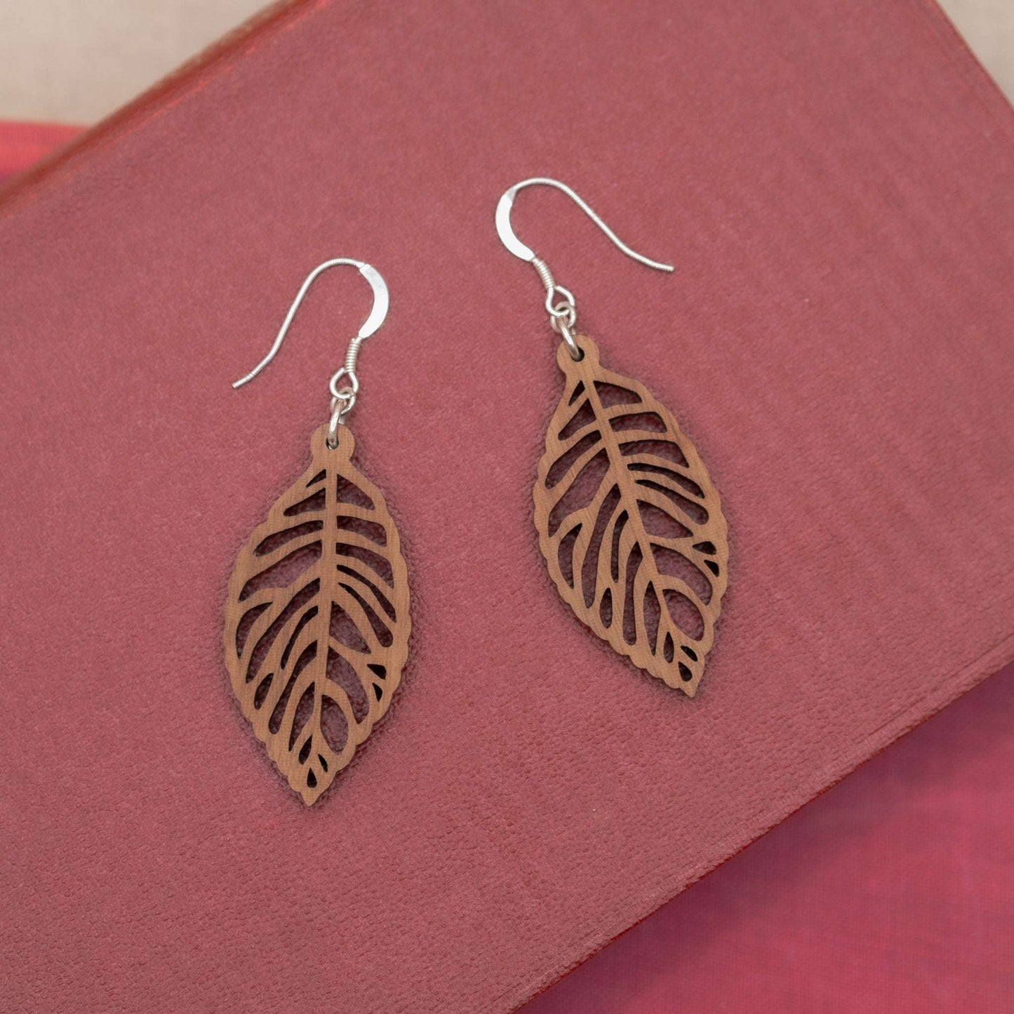 Leaf skeleton drop earrings hung on recycled sterling silver hooks