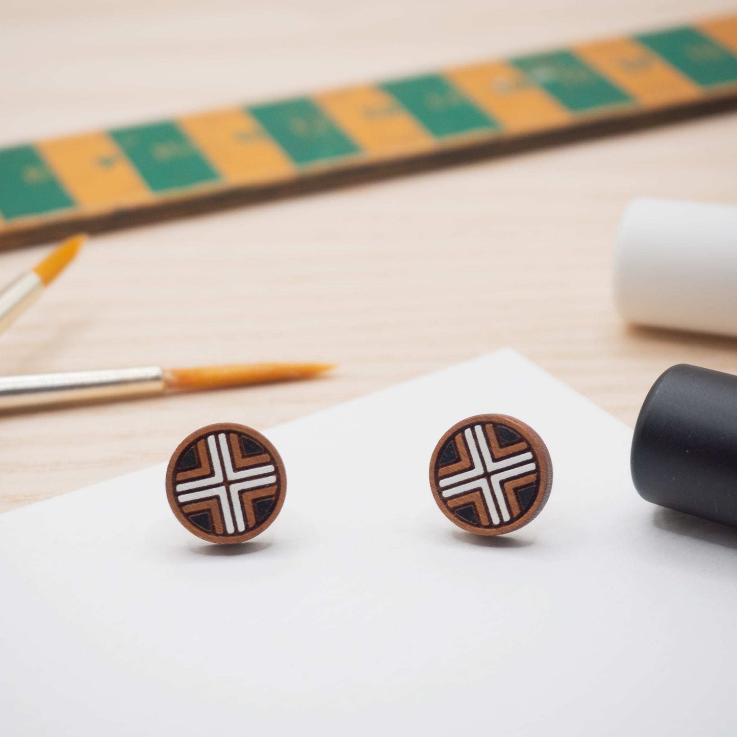 Make your mark with our solid cherryt wood black and white geometric painted studs 