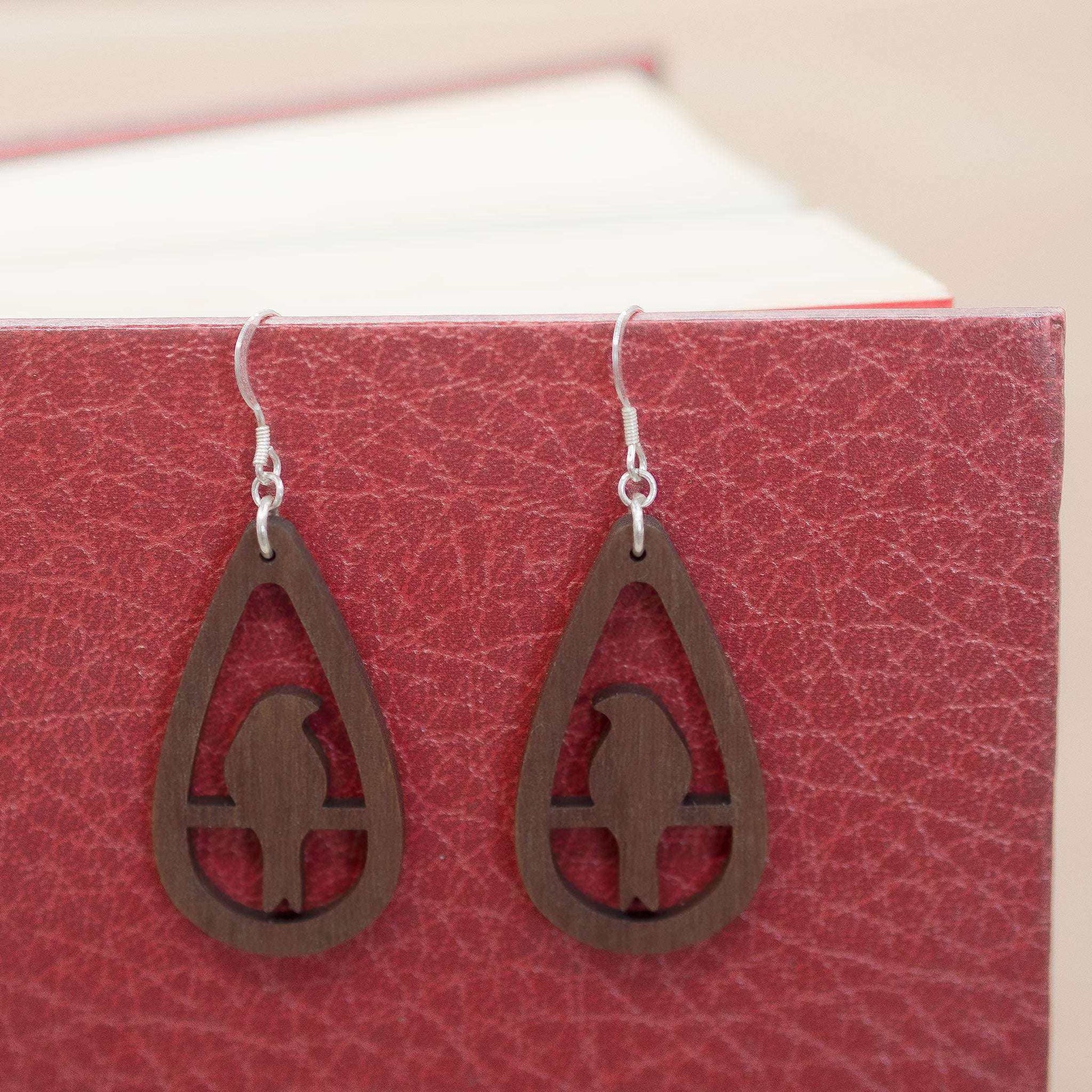 Perching bird teardrop earrings.