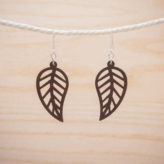 Leaf outline drop earrings suspended on delicate sterling silver hooks