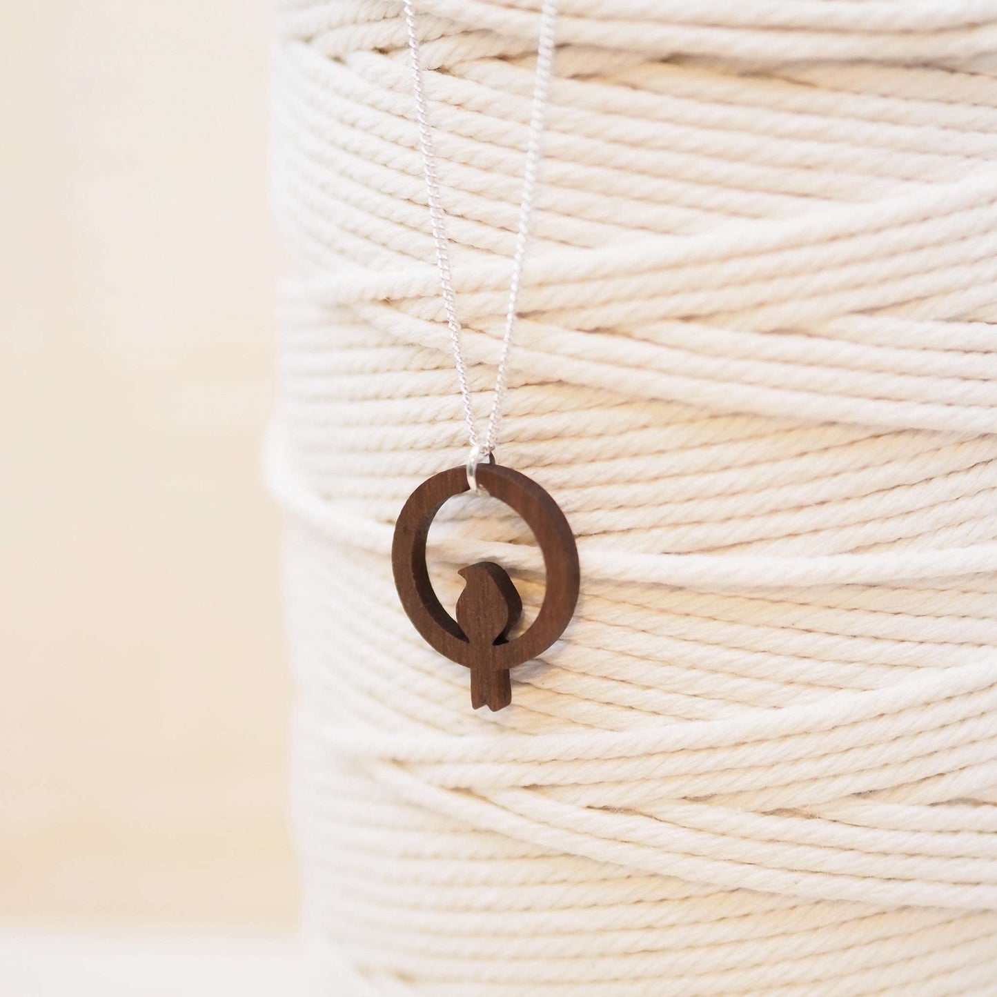 Delicate bird hoop necklace hung from an 18 inch recycled sterling silver chain