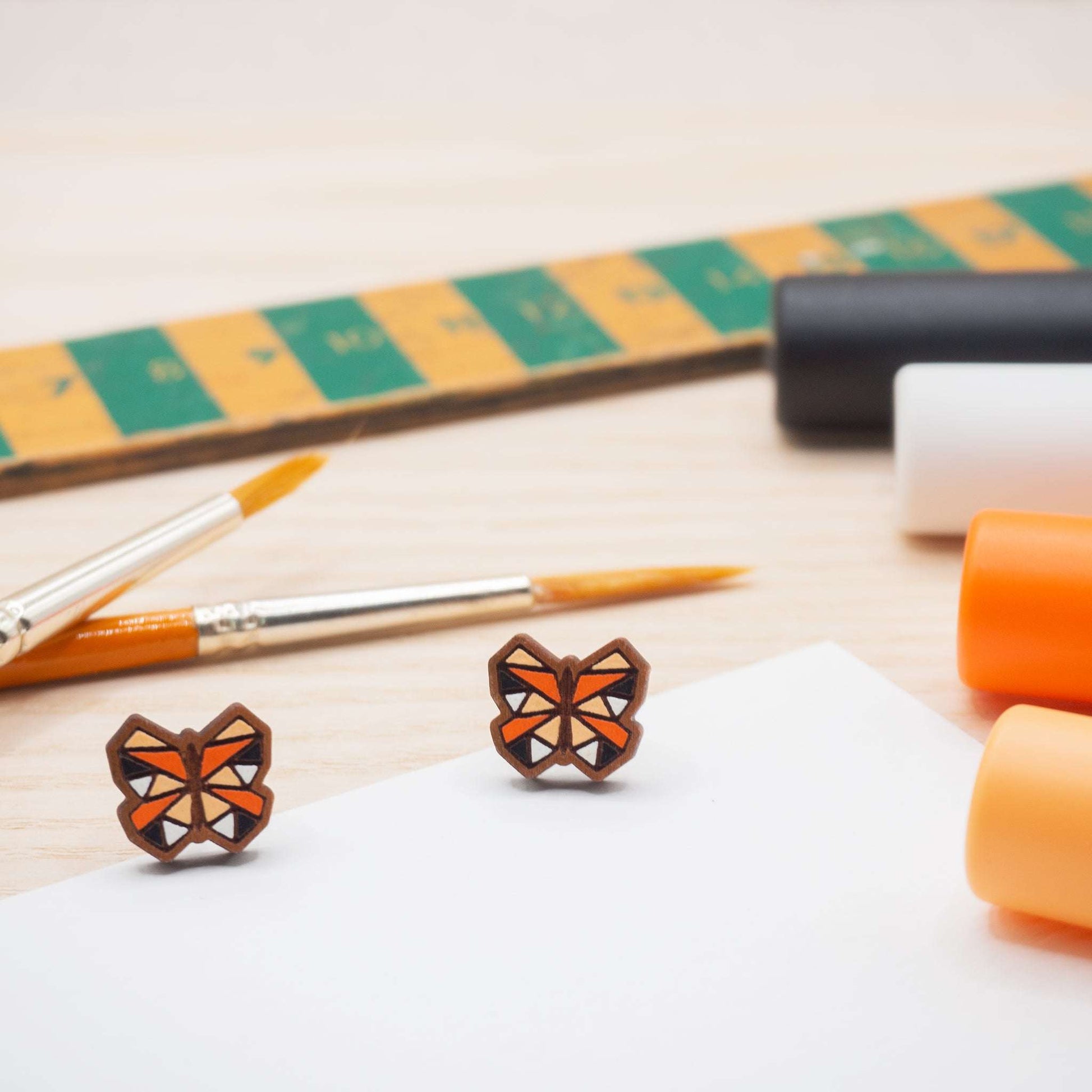 Orange butterfly painted stud earrings.Lovingly crafted on the Isle of Skye